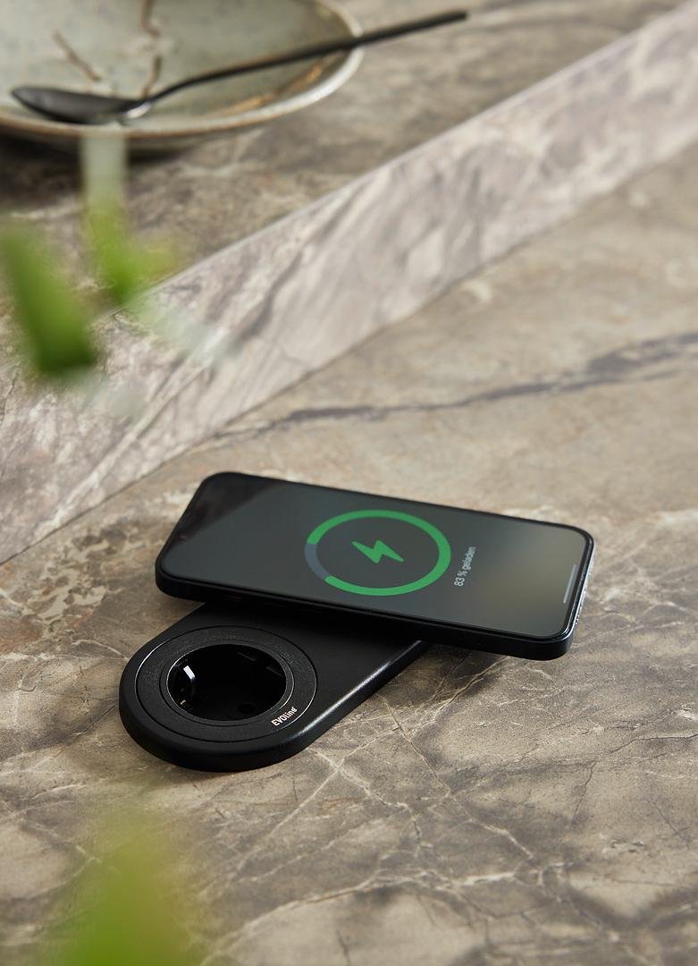 Built-in wireless phone charger integrated into a Nolte kitchen countertop