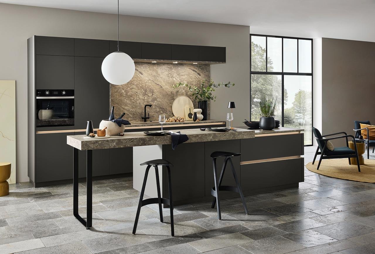 Real installed Nolte kitchen in graphite with a marble-look island and bar seating